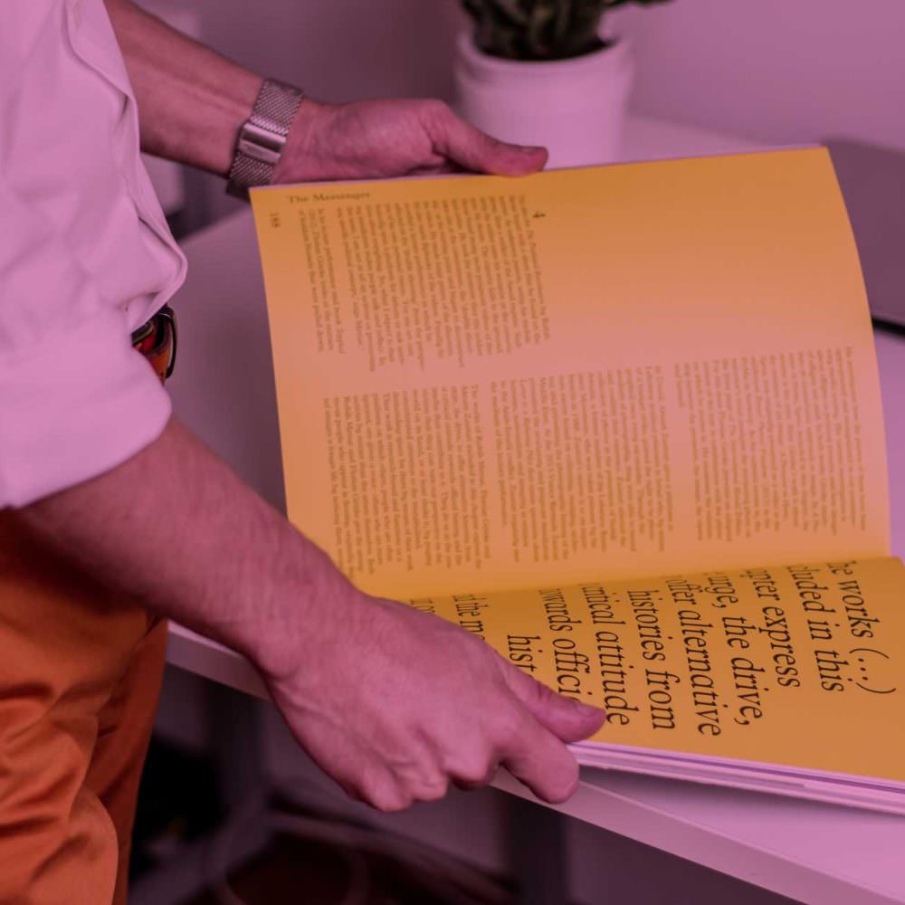 Man Reading Magazine Advert